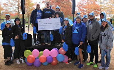 ACE Cash Express presented a $23,259 donation to Hunter Heidtke, Senior Field Development Coordinator at Autism Speaks