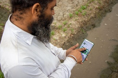 Farmer using Upaj App