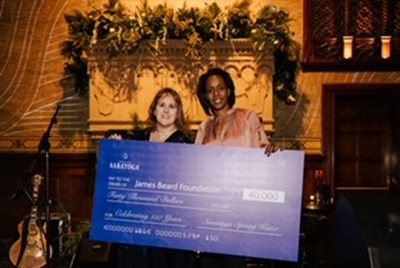 BlueTriton Chief Marketing Officer Kheri Tillman (left) presents Jaime-Faye Bean, James Beard Foundation Vice President of Sponsorships and Development with a $40,000 check to support the group’s continued work in the culinary arts. Photo by: Alfred Vincent Garcia for Saratoga Water