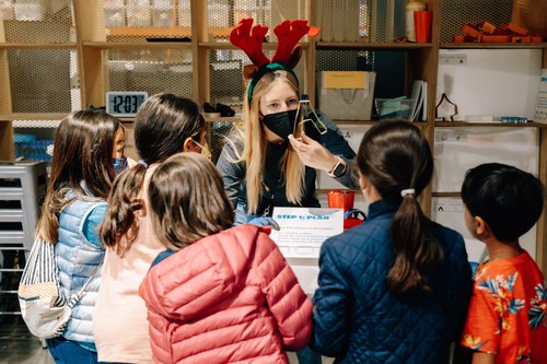 The Tech Interactive teammate Kate Sover shows a group of young visitors how to use tools and engineering design and make their own cookie cutter. It's one of a series of activities at San Jose's The Tech Interactive. Visit thetech.org to see activity times.