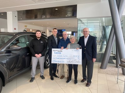 Scott Bieler, president, Steve Fessel, salesman, and Frank Comisso, general manager for West Herr Automotive Group, present Wende and James Tuskes with a check for the first year of payments on their all-new Hyundai Tucson. Photo L to R: Steve Fessel, Frank Comisso, James Tuskes, Wende Tuskes, Scott Bieler