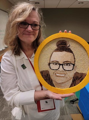Vivian Hoover holds a floragraph depicting her daughter, Brittany. This special portrait of plant materials will be featured on the Donate Life Rose Parade float to honor Brittany, who saved four lives through organ donation.