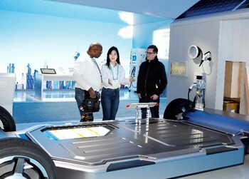 SK’s exhibit team for CES 2023 discuss a display for SK On’s EV batteries. The batteries are one of more than 40 carbon-cutting technologies SK and its partners will show at CES this week. SK’s exhibit team for CES 2023 discuss a display for SK On’s EV batteries. The batteries are one of more than 40 carbon-cutting technologies SK and its partners will show at CES this week.