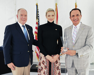FORT LAUDERDALE, FLORIDA - DECEMBER 29: T.S.H. Prince Albert II and Princess Charlene with gift for Fort Lauderdale Mayor Dean Trantalis during a special event at the Fort Lauderdale Aquatic Center on December 29, 2022. (Photo by Jason Koerner/Getty Images for City of Fort Lauderdale)