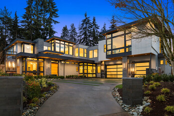 Modern luxury in a tranquil setting describes MN Custom Homes' Northwest Idea House set back among tall evergreens.