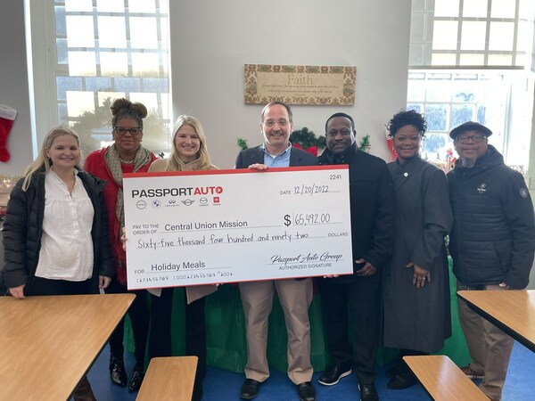 Central Union Mission President Joseph Mettimano and Vice President Rev. Deborah Chambers stand with Passport Auto Group’s Chesney Hellmuth Floyd, Ashton Hellmuth Ryan, Chester Pinkney, Calancy Boyd, and Tony Contee on Tuesday, December 20th, 2022.