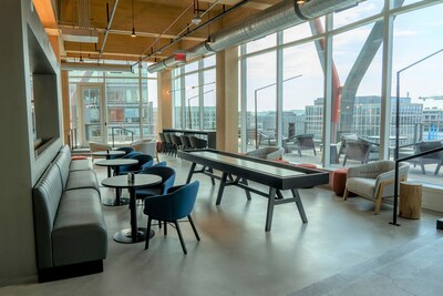 ATA's new headquarters is the first mass timber construction project in the city of Washington, D.C. The exposed wood beams are seen here in the new employee lounge and cafeteria.