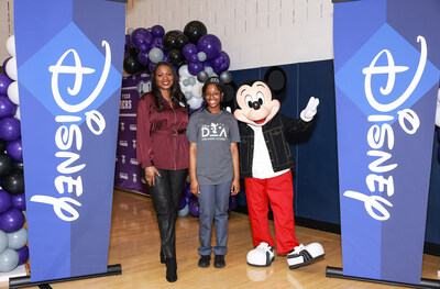 Mickey Mouse and Disney Dreamers Academy executive champion Tracey Powell pose with Newark Tech (N.J.) high school student Mosope Aina moments after she was surprised on national TV on January 13, 2023 with the news that she is one of 100 students selected for this year’s Disney Dreamers Academy at Walt Disney World Resort in Florida in March. Also, the names of all 100 Dreamers were displayed on a Times Square billboard. Disney Dreamers Academy is a mentoring program hosted annually at Walt Dis