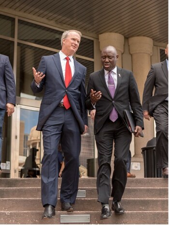 Attorneys Bob Hilliard and Ben Crump leaving a court house.