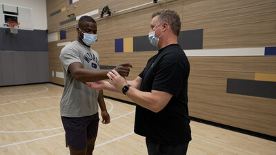 Tennis star Frances Tiafoe works with his physical therapist MedStar Health Director of Elite Sports Therapy Lance Kelly, PT, ATC.