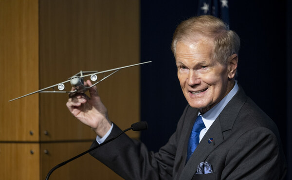 NASA Administrator Bill Nelson holds a model of an aircraft with a Transonic Truss-Braced Wing during a news conference on NASA's Sustainable Flight Demonstrator project, Wednesday, Jan. 18, 2023, at the Mary W. Jackson NASA Headquarters building in Washington, DC. Through a Funded Space Act Agreement, The Boeing company and its industry team will collaborate with NASA to develop and flight-test a full-scale Transonic Truss-Braced Wing demonstrator aircraft. Photo Credit: (NASA/Joel Kowsky)