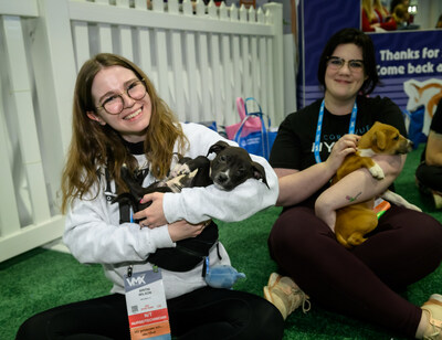 Veterinary professionals take a break from attending sessions to visit the Puppy Playground on the VMX Expo Floor