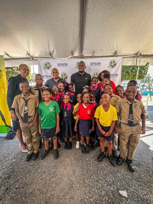 Epson Ambassador Usain Bolt pictured with children from New Providence Primary School in Jamaica, Fayval Williams, Minister of Education and Youth; Olga Robinson Clarke, Principal at New Providence Primary School and Darren Virtue, Chairman of the school