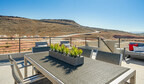 Table on rooftop terrace with scenic ridge in the background