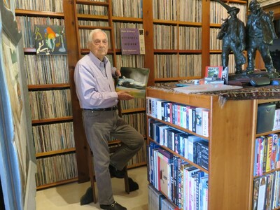 Bram Dijkstra standing in front of a portion of his collection prior to it being shipped to Stanford Libraries, where it will be permanently housed as part of its Archive of Recorded Sound at the Music Library. Photo by Sandy Dijkstra.