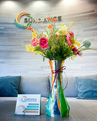 SunDance's new stand-up pouch die-cutter was used to create a unique mylar vase that can hold floral arrangements and water.