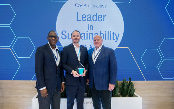 Jeff Miller, General Manager and CEO of Mark Miller Subaru (middle) is presented the Cox Automotive 2023 Leader in Sustainability Award by Cox Automotive President Steve Rowley (right) and Roland Ambe, Director of Sustainability at Cox Automotive (left).