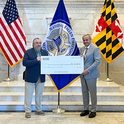 Chief Ron Siarnicki (left), Executive Director of the National Fallen Firefighters Foundation, accepting a $25,000 donation from Henry Repeating Arms CEO and Founder Anthony Imperato (right).