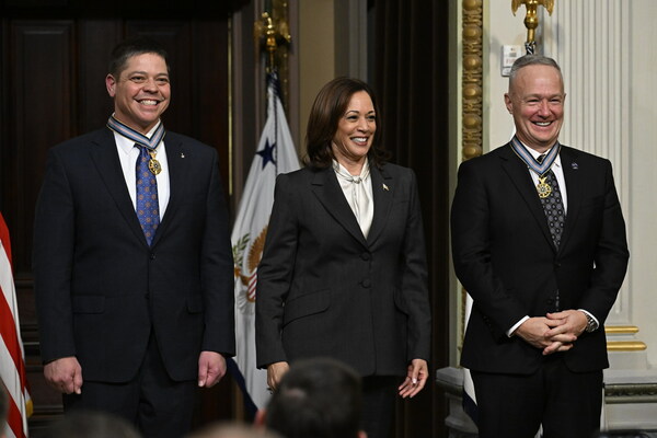 Former NASA astronauts Robert Behnken, left, and Douglas Hurley, right, are seen after being awarded the Congressional Space Medal of Honor by Vice President Kamala Harris during a ceremony in the Indian Treaty Room of the Eisenhower Executive Office Building, Tuesday, Jan. 31, 2023 in Washington. Former astronauts Behnken and Hurley were awarded the Congressional Space Medal of Honor for their bravery in NASA’s SpaceX Demonstration Mission-2 to the International Space Station in 2020, the first crewed flight as part of the agency’s Commercial Crew Program. Photo Credit: (NASA/Joel Kowsky)
