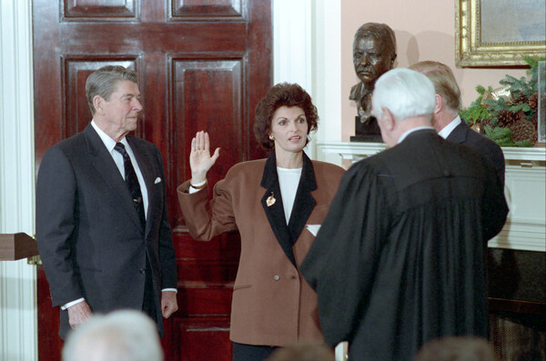 12/17/1987 Swearing In of Ann McLaughlin as Secretary of Labor by Warren Burger in Roosevelt Room, with President Reagan standing nearby