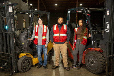 The first graduates of WorkWhile's forklift training & certification program on the warehouse floor in California.