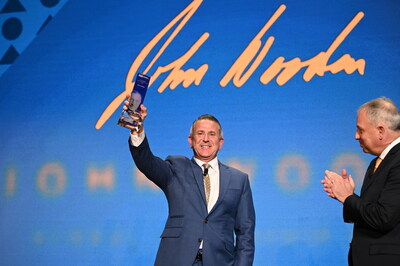 Brian Cornell, Board Chairman and Chief Executive Officer of Target, accepts John Wooden Global Leadership Award from UCLA Anderson Dean Tony Bernardo.