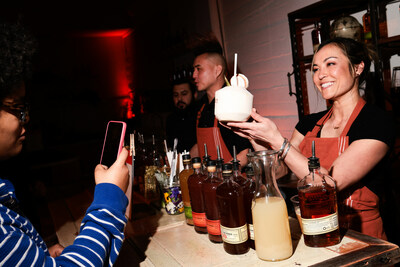 Stephanie Reading mixes cocktails at “A Toast To The Times” premier by Bulleit Frontier Whiskey