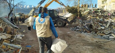 HHRD team member observes damage while distributing blankets.