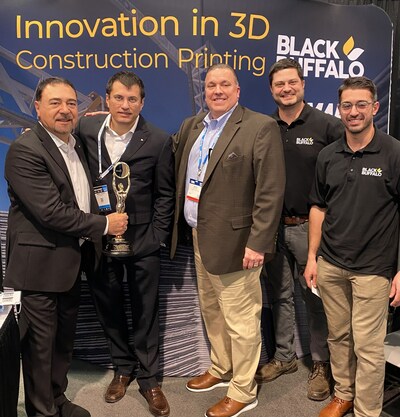 Left to right, Luigi Di Geso, MAPEI North America's President and CEO; Marco Squinzi, MAPEI Global Co-CEO; Kevin Smith, MAPEI CRS Director of Product Development and Product Management; Peter Cooperman, BB3D Interim CMO; and George Perry, BB3D Head of Technology Pose at the NAHB IBS Builders Show with their Award for Global Innovation from The Nationals-NAHB.
