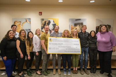 MIB Agents Presenting Dr. Dan Regan with a $100,000 OutSmarting Osteosarcoma Research Grant