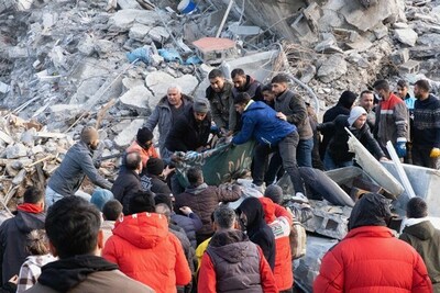 Volunteers pull victims of the earthquake from rubble on February 7, 2023 in Antakya, Hatay Province, Turkey.