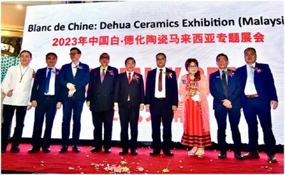 Fang Junqin (4th R), head of Dehua County, Quanzhou, southeast China's Fujian Province, poses for a group photo with guests at an exhibition featuring Dehua ceramics, which kicks off on Saturday at Sunway Pyramid Shopping Center in Selangor, Malaysia. (PRNewsfoto/Xinhua Silk Road)