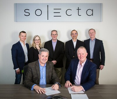 Solecta’s Jim Ford (front left) and Lubrizol’s Matthew Joyce (front right) executed a formal partnership agreement at Solecta's corporate office. Attending the signing were Solecta team members Mariusz Grzelakowski, Melinda Burn, Erik (Skip) Smith, Aseem Sharma, and Lubrizol’s Michael Fornes.