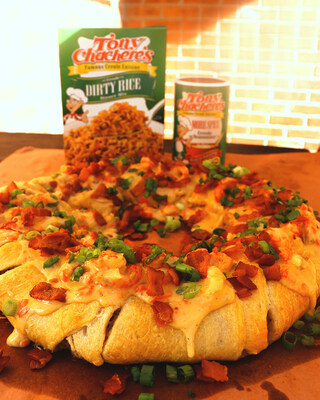 This Mardi Gras season, swap out sweet for savory with this king cake. Tony Chachere’s Boudin King Cake is filled with juicy pork and topped with a creamy and cheesy crawfish sauce.