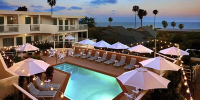 The beachside pool at the Laguna Beach House in Orange County, California, one of the poolside vacation destinations with below-average rates for a 3-day trip.