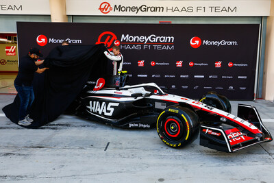 MoneyGram and urpay customer, Nawaf Alqahtani, and MoneyGram Haas F1 Team drivers, Kevin Magnussen and Nico Hülkenberg, unveil VF-23 in Bahrain