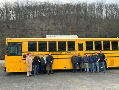 Mineral County Schools taking delivery of a GreenPower BEAST all-electric purpose-built school bus. In the photo are GreenPower Motor Vice President Mark Nestlen; John Droppleman, Director of Support Services; Todd Liller, Transportation Director; Troy Ravenscroft, Superintendent; Jay Harris, Director of Maintenance; Hannah Rexrode, Driver; Brian Alt, Lead Mechanic; Ronnie Lewis, Mechanic; Reuben Pancake, Mechanic and Adam Braithwaite, Driver.