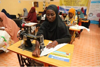 Women learning sewing at a skills workshop by HHRD in Kenya.