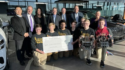 (left to right) Mike Song, Global Head of Genesis, Tim M. Bergstrom, president and CEO, Bergstrom Automotive, Claudia Marquez, chief operating officer, Genesis Motor North America, Phil Kerwin and Chris Decker, St. Mary Catholic Schools, Brandon Ramirez, director, corporate social responsibility, Genesis Motor America, Christine Cedergren, St. Mary Catholic Schools at Bergstrom Genesis of Appleton in Appleton, WIS. on March 2, 2023. (Photo/Genesis)