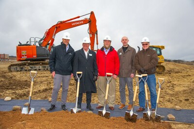 Following the groundbreaking, those involved in the project pose at the headquarters site. From left to right: Casey Creech, Chief Revenue Officer of Everlight Solar; Tom Spritz, CEO of Settlers Bank; William Creech, President and CEO of Everlight Solar; Wesley Walsh, loan officer and business lending partner; Edward Kinney, SVP Commercial Lending at Settlers Bank. Photo by Brad Trick.