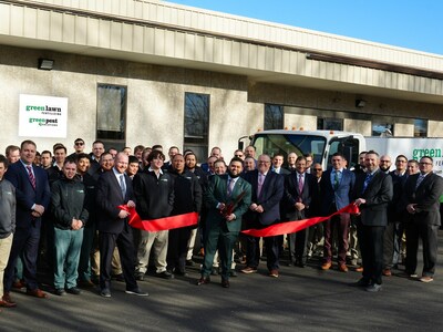 Steven Reyes cuts the ribbon at Green Lawn Fertilizing / Green Pest Solutions' newest branch in North Wales, PA