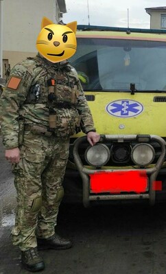 Medic in Ukraine with Ambulance in the Background