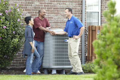 Carrier technician discusses energy-efficiency savings with residential HVAC customers.