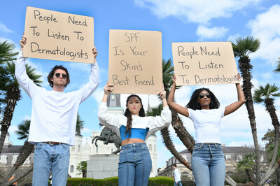 Dude With Sign, Avani Gregg, and Dudette With Sign seen in the French Quarter in New Orleans, Thursday, March 16, 2023, to raise awareness of wearing SPF daily with CeraVe. (Photo by Cheryl Gerber/Invision for CeraVe/AP Images)