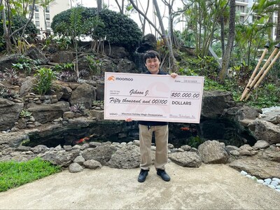 Gihoon J. of Honolulu receives the grand prize of $50,000 from moomoo.