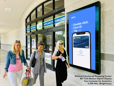 A Tampa shopping center anchored by a Walmart displays an Apple Pay ad, which increased the use of service by customers to all retailers at that center, and even on their mobile devices. The 86" full-motion digital display is equipped with two cameras for analytics. The partnership between Quantela, Starlite Media, and Digital Alpha, announced on March 23rd, will increase the number of displays in shopping locations across the United States.
