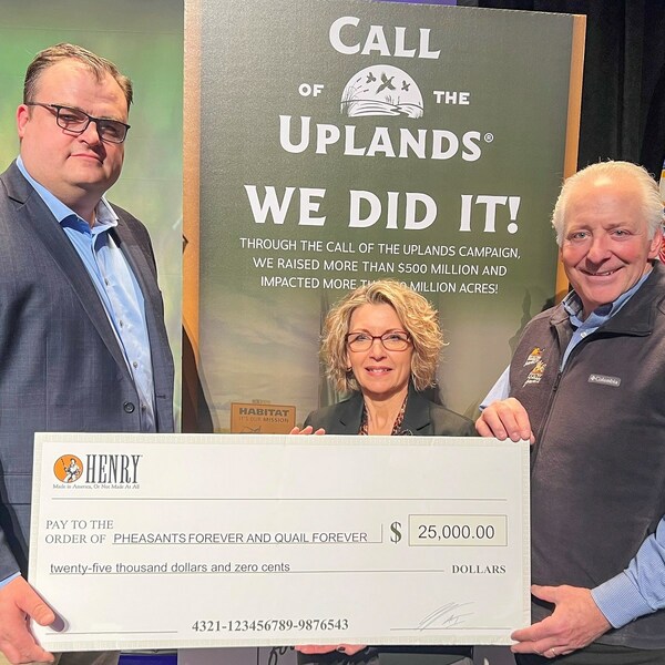 Henry Repeating Arms President Andy Wickstrom (left) presents a check for $25,000 to Pheasants Forever and Quail Forever’s newly appointed President and CEO Marilyn Vetter (middle) and the organizations’ outgoing president and CEO Howard Vincent (left) at the 2023 National Pheasant Fest & Quail Classic.