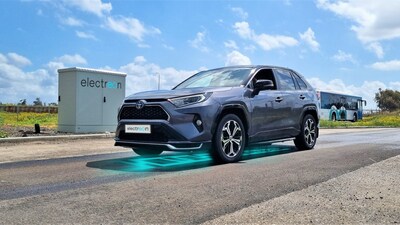 The Toyota RAV4 charging wirelessly while driving at Electreon's HQ (PRNewsfoto/Electreon)