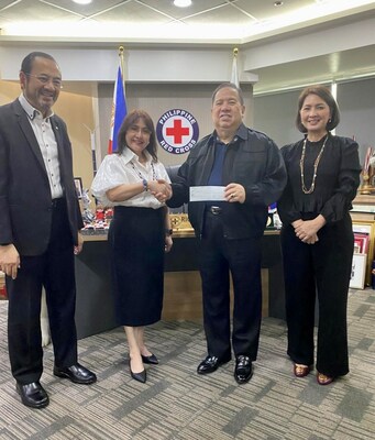 SMFI's Connie Angeles (second from left) hands the donation to Philippine Red Cross chairperson Dick Gordon (third from left). Joining the turnover are PRC Governor Ernesto Isla and PRC Secretary General Dr. Gwen Pang (first and fourth from left, respectively).