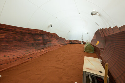 NASA's simulated Mars habitat includes a 1,200-square-foot sandbox with red sand to simulate the Martian landscape. The area will be used to conduct simulated spacewalks or 
